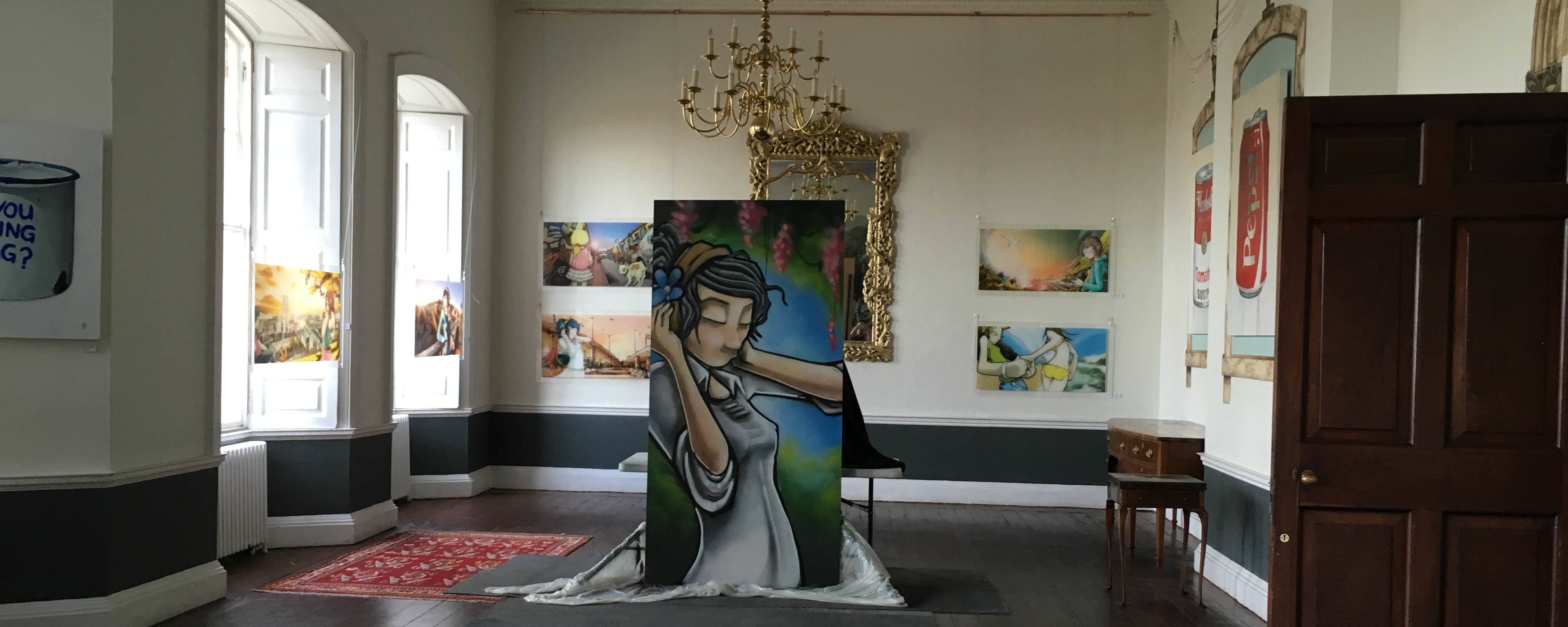 An art exhibition in the Vanbrugh Room at Kings Weston House